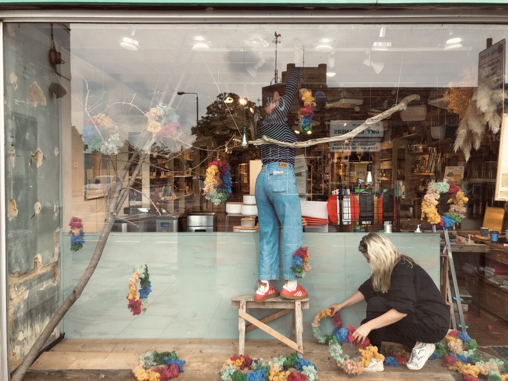 Above: A local florist installed the rainbow themed window at The Kitchen Range.
