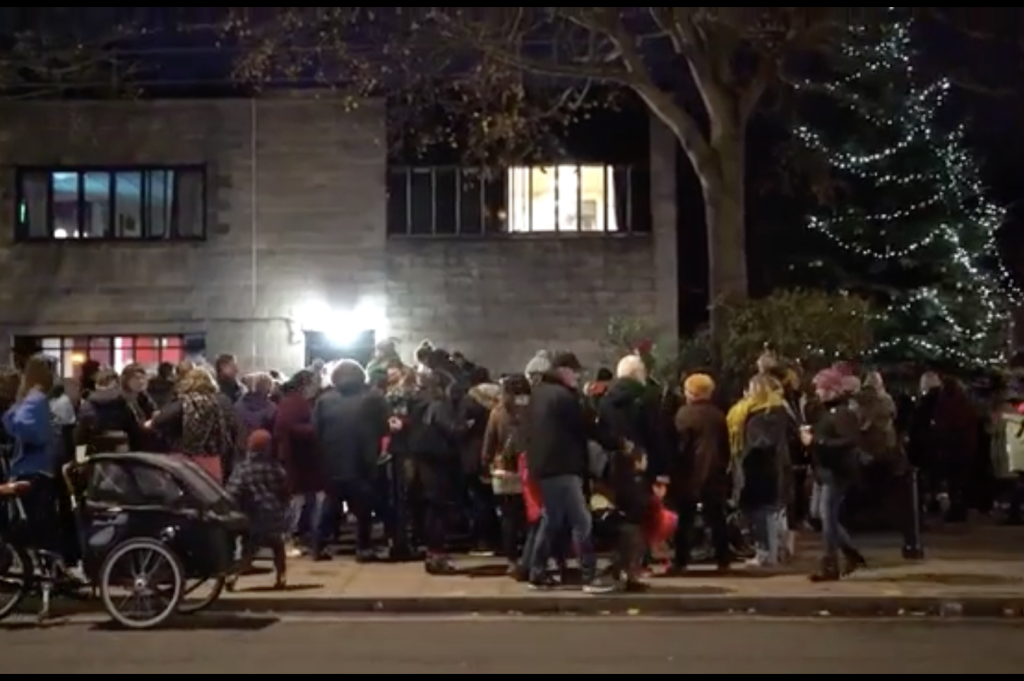 Above: A scene from the Christmas lights switch-on in Stoke Newington on December 4, as filmed by local estate agent Location Location.